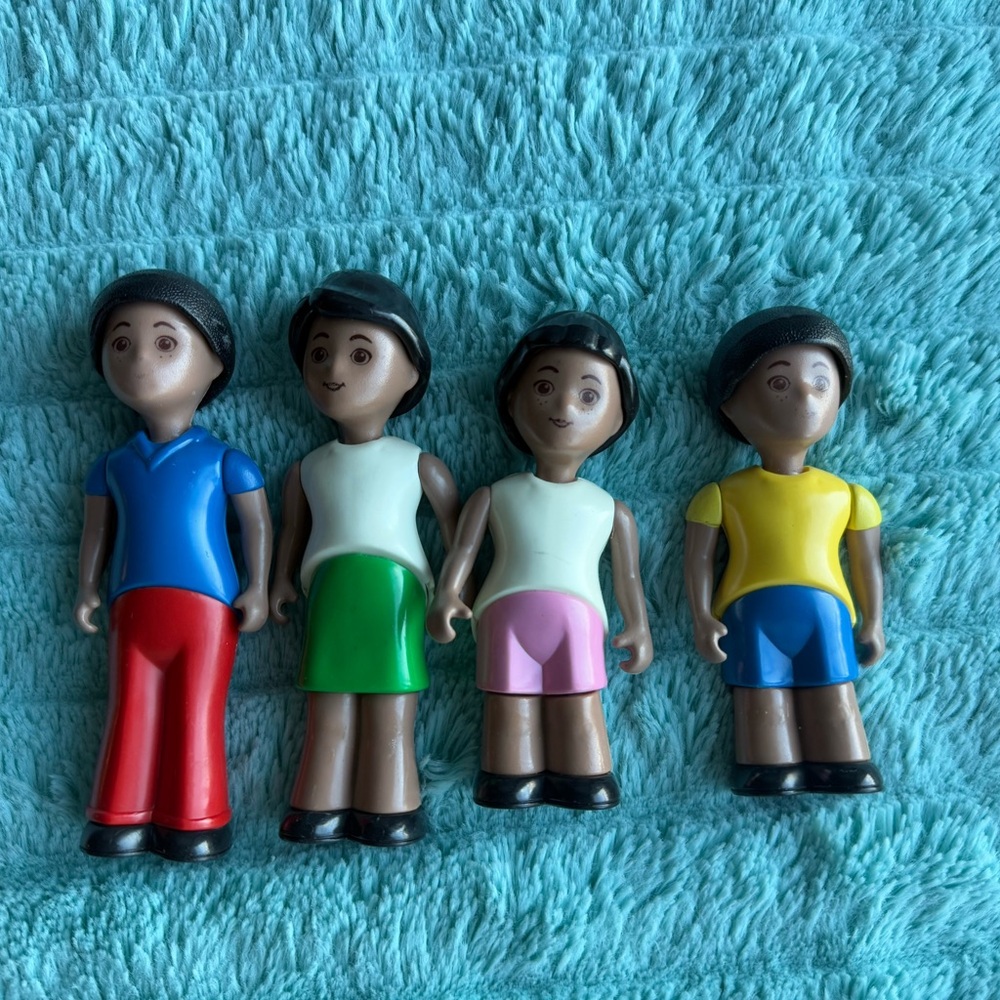 Vintage Little Tikes playhouse dark skinned family.